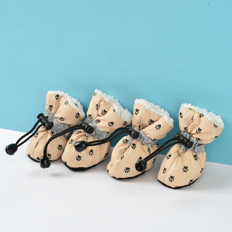 Chaussures imperméables et antichoc pour chiens avec motif de pattes, idéal pour protéger les pattes des animaux.