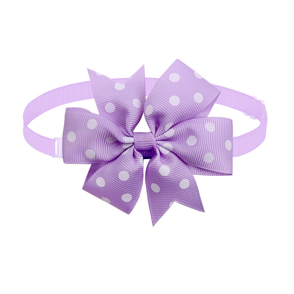 Nœud papillon violet à pois pour chiens et chats, accessoire élégant en ruban côtelé.