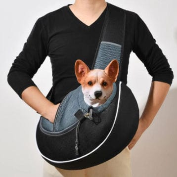 Sac à dos portable pour animaux de compagnie avec un chien dans une conception confortable et respirante.