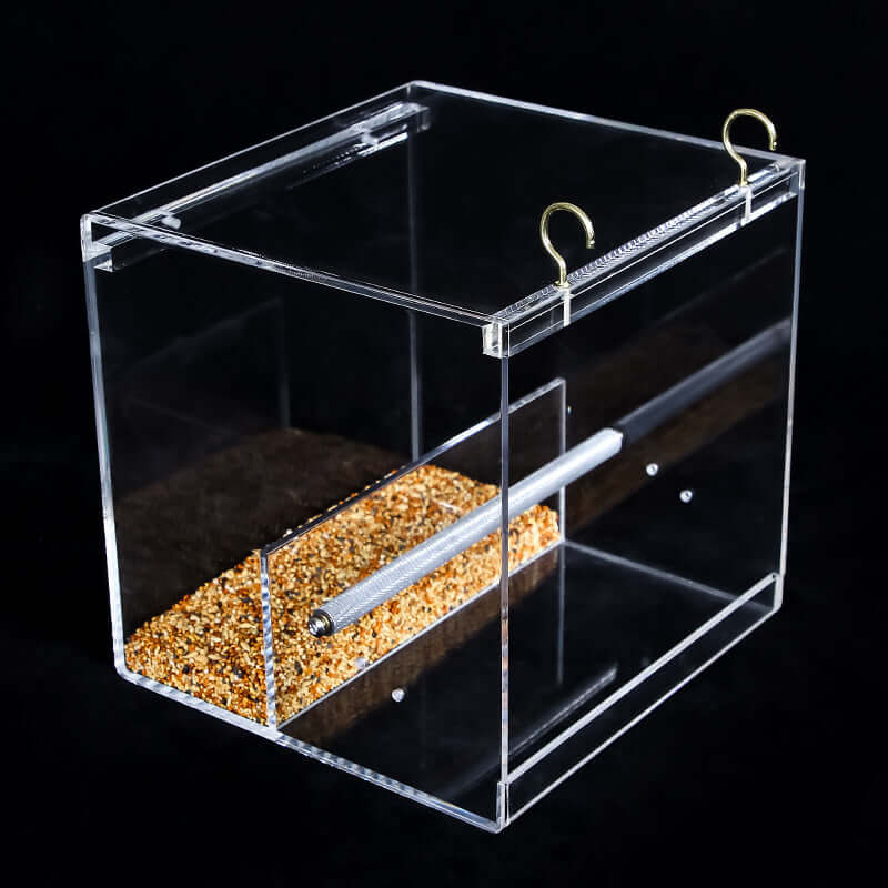 Translucent acrylic bird feeder designed for safe and healthy feeding of pet birds.
