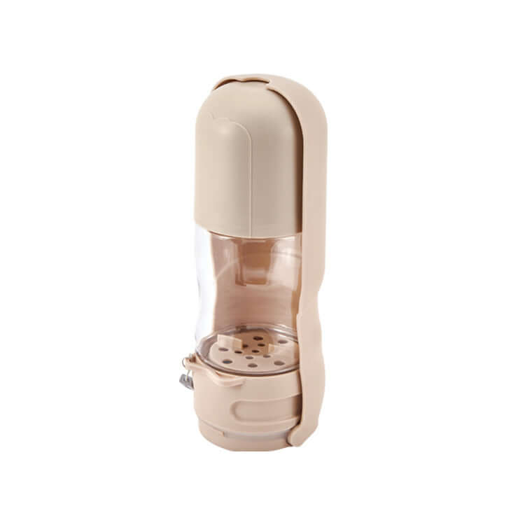 Bol portable pliable pour chiens avec fontaine intégrée, design compact et pratique pour l'hydratation en extérieur.