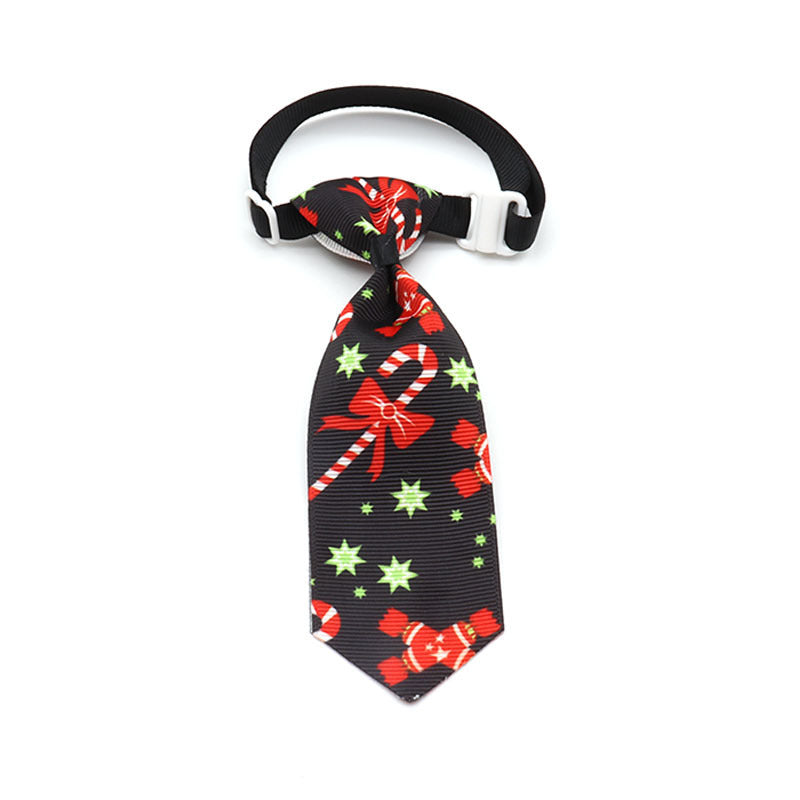 Nœud papillon de Noël pour animaux avec motifs de bonbons et étoiles sur fond noir, idéal pour fêtes.