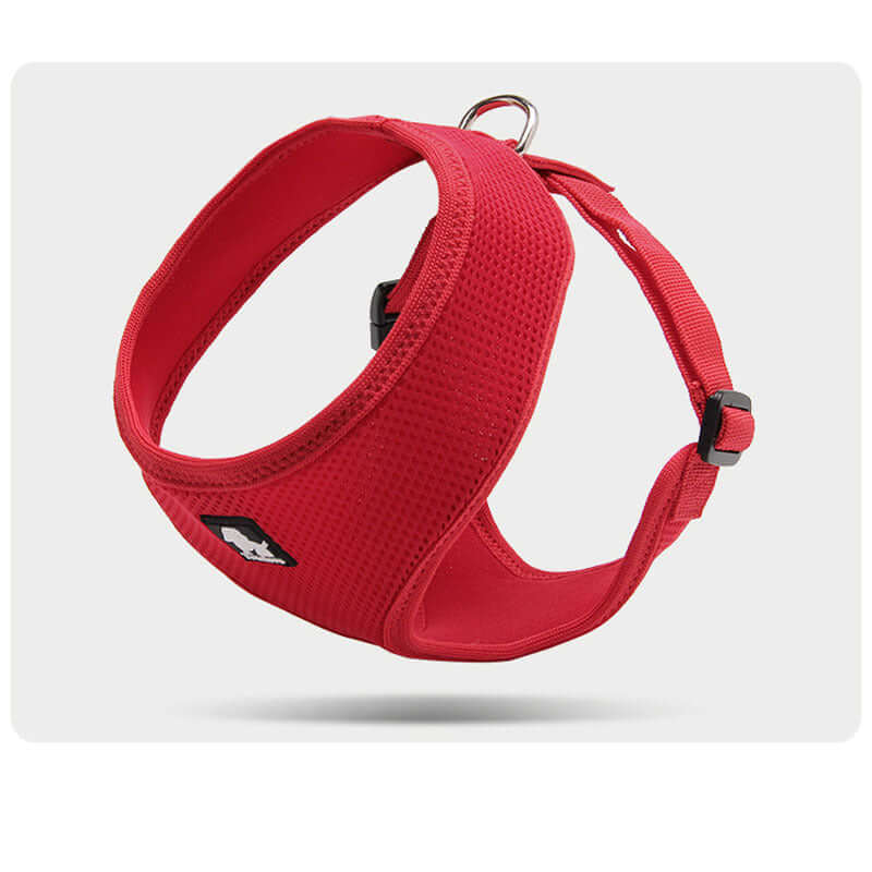 Harnais de sécurité rouge pour petits chiens, conçu pour le confort et la sécurité lors des promenades.
