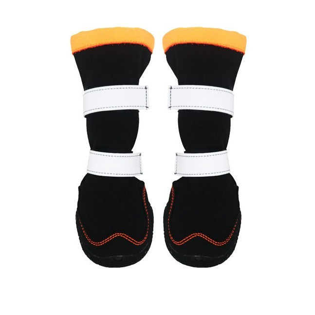 Bottes chaudes et douillettes pour chiens en noir et orange, idéales pour l'automne et l'hiver.