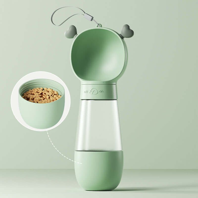 Gobelet d'eau portable pour chiens en couleur verte, avec réservoir pratique et compartiment pour nourriture.