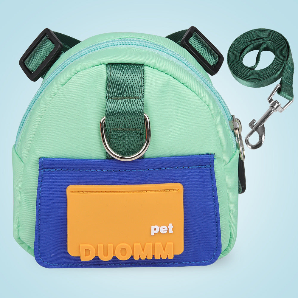Sac à dos multifonction pour chiens, couleur verte et bleue, avec bandoulière et accès pratique au contenu.