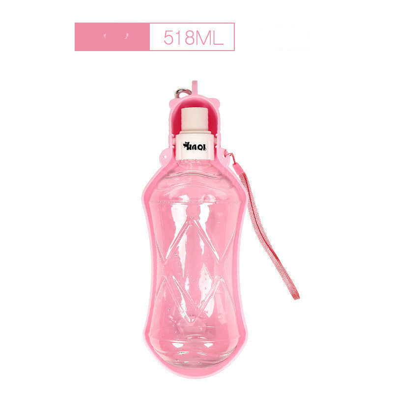 Bouteille d'eau portable pour chiens 518ml en rose, idéale pour hydratation lors de promenades.