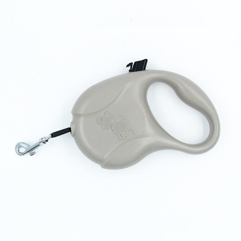 Laisse pour chien automatique à enrouleur en couleur grise, accessoire durable pour promenades.