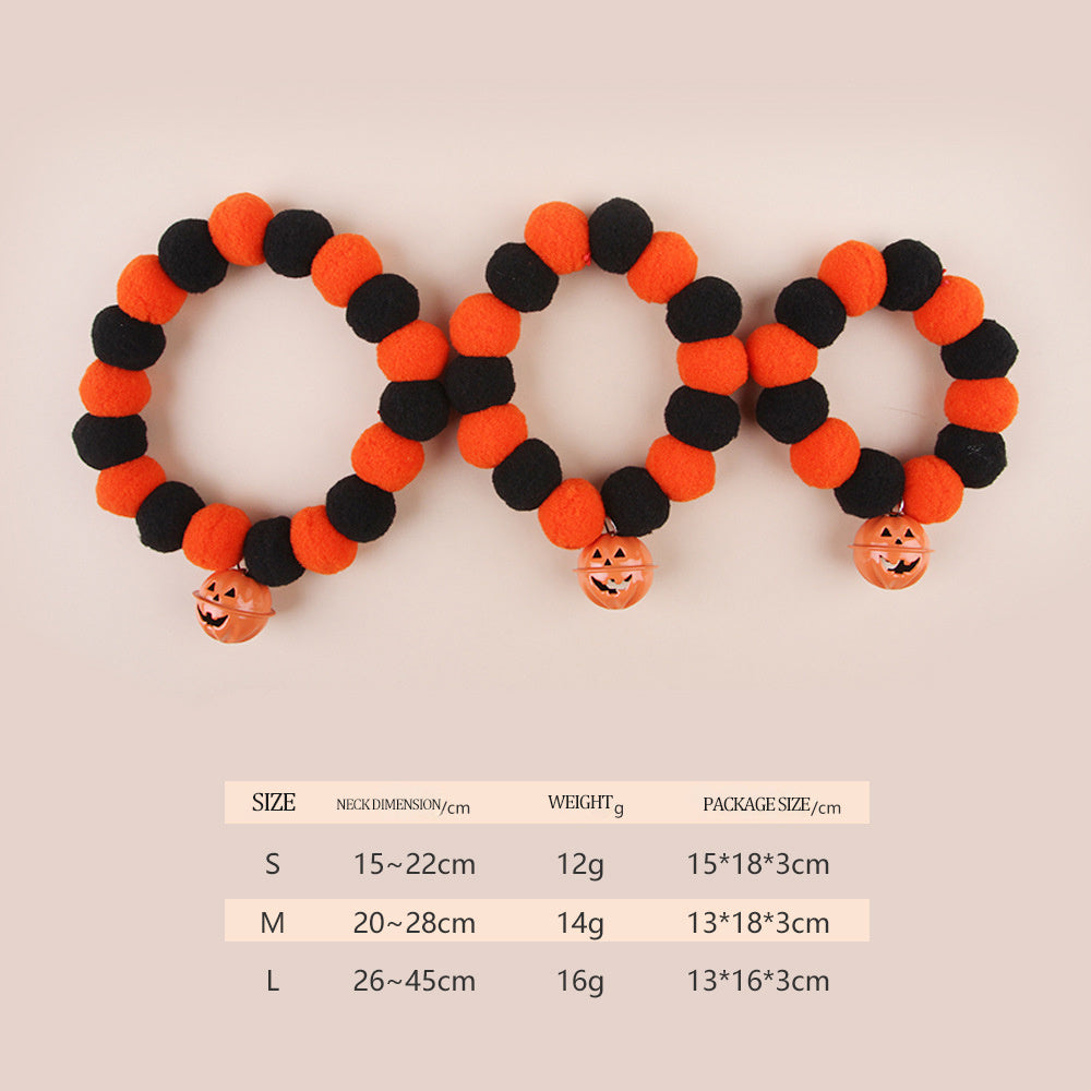 Set of three Halloween-themed cat collars with pumpkin charms, perfect for festive pet accessories.