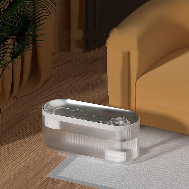 Distributeur d'eau sans fil pour chats en ABS, design moderne, placé près d'un canapé.