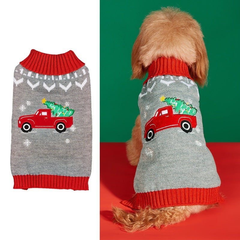 Pull de Noël pour chien avec motif de camion rouge et sapins de Noël, idéal pour les fêtes.