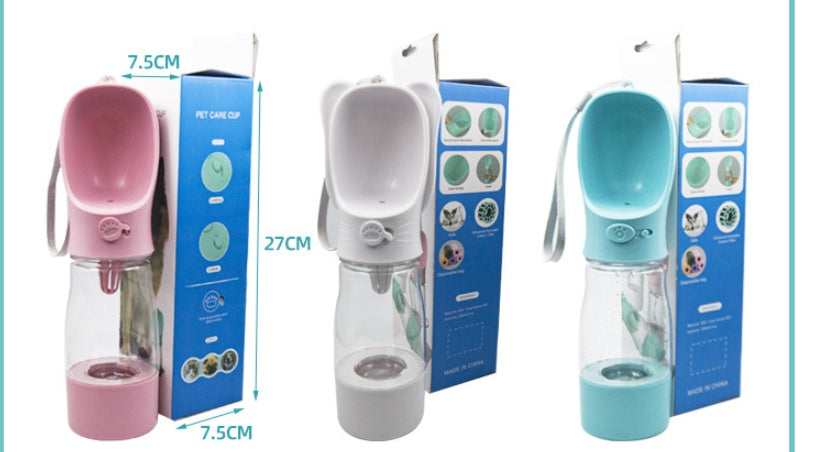 Distributeur d'eau pour animaux de compagnie, portable et pratique, avec design ergonomique en rose et bleu.
