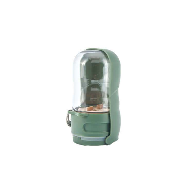 Lampe de camping portable de couleur verte, idéale pour les activités en plein air, avec un design compact et efficace.