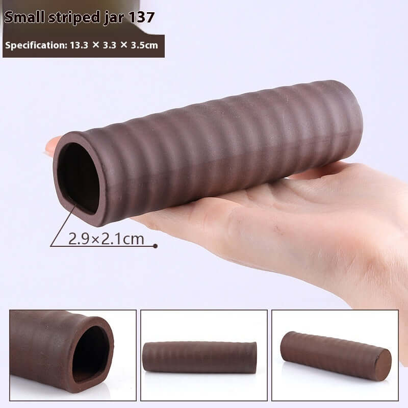 Small striped jar made of brown material, dimensions 13.3x3.3x3.5cm, held in hand for scale.