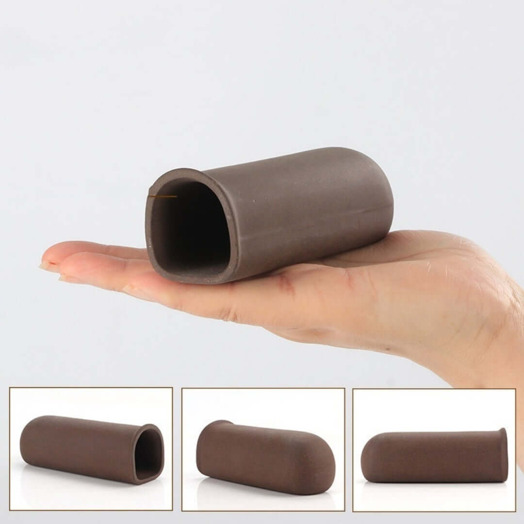 Main image of a brown silicone pet toy held in a hand, designed for interactive play with pets.
