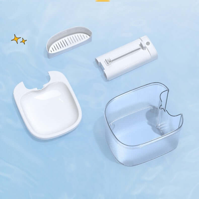Distributeur d'eau sans fil pour animaux, pièces détachées sur fond bleu, facilité d'hydratation pour chats.