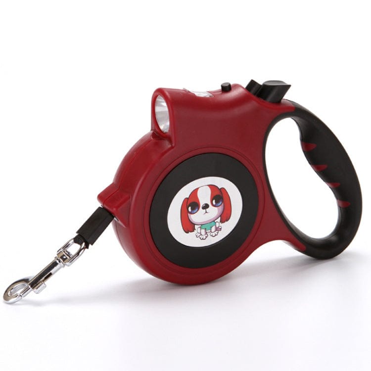 Laisse automatique lumineuse pour chien rouge avec poignée ergonomique, idéale pour les promenades nocturnes.
