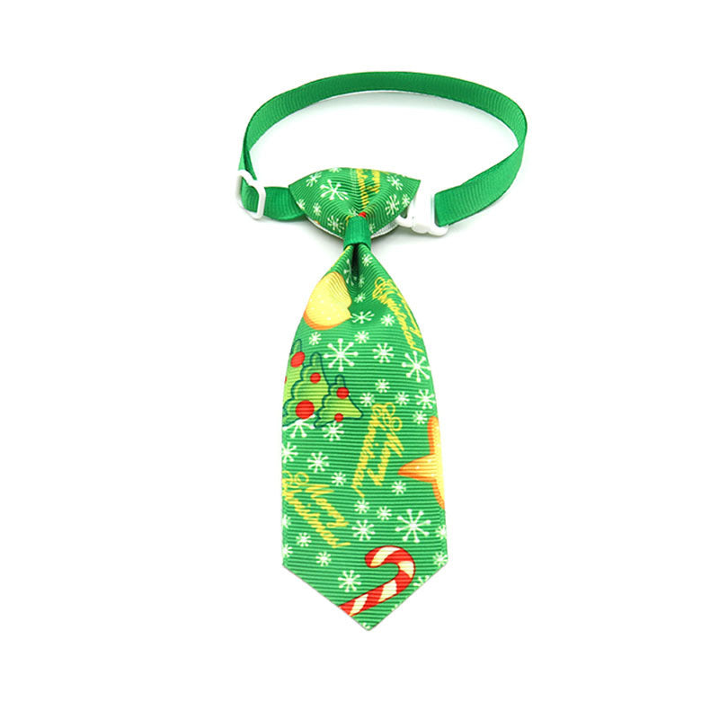 Nœud papillon de Noël vert festif pour animaux de compagnie avec motifs colorés.