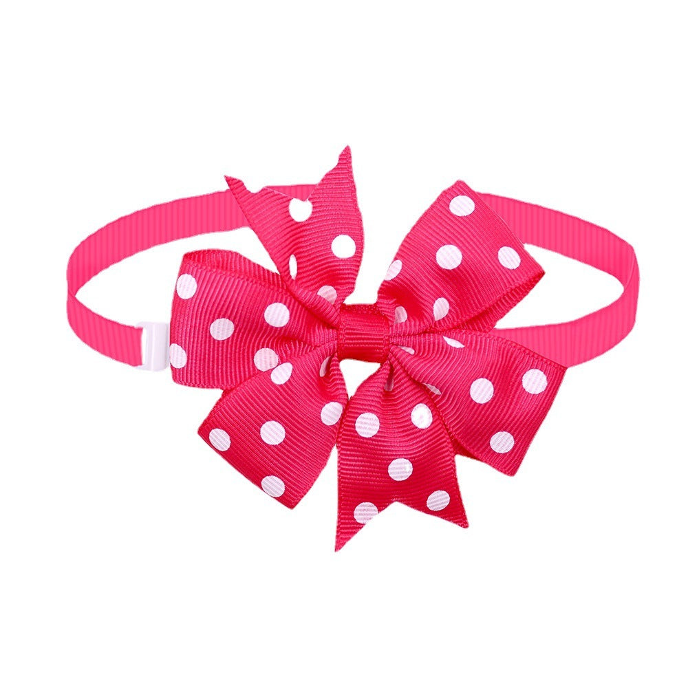 Nœud papillon rose à pois pour chiens et chats, accessoire élégant pour animaux de compagnie.
