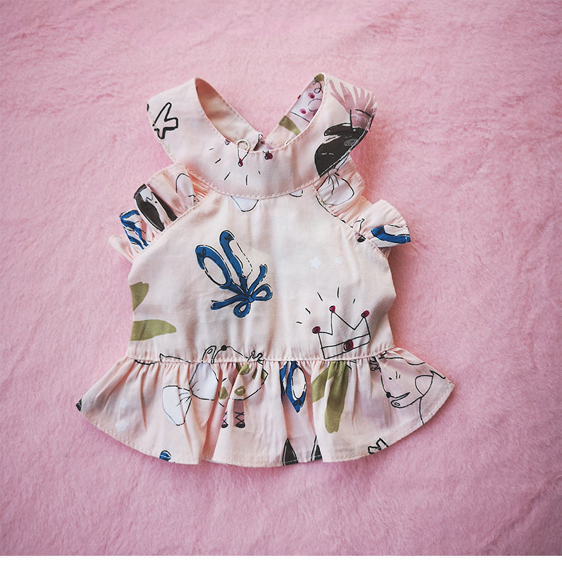 Jupe en coton rose cartoon pour chiens et chats, avec motif coloré et volants, idéale pour le confort et le style.