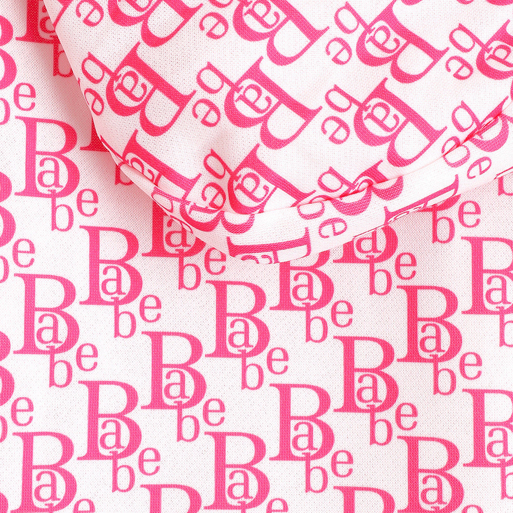 Close-up of pink letter print fabric for wholesale cat clothing, featuring bold and stylish design.
