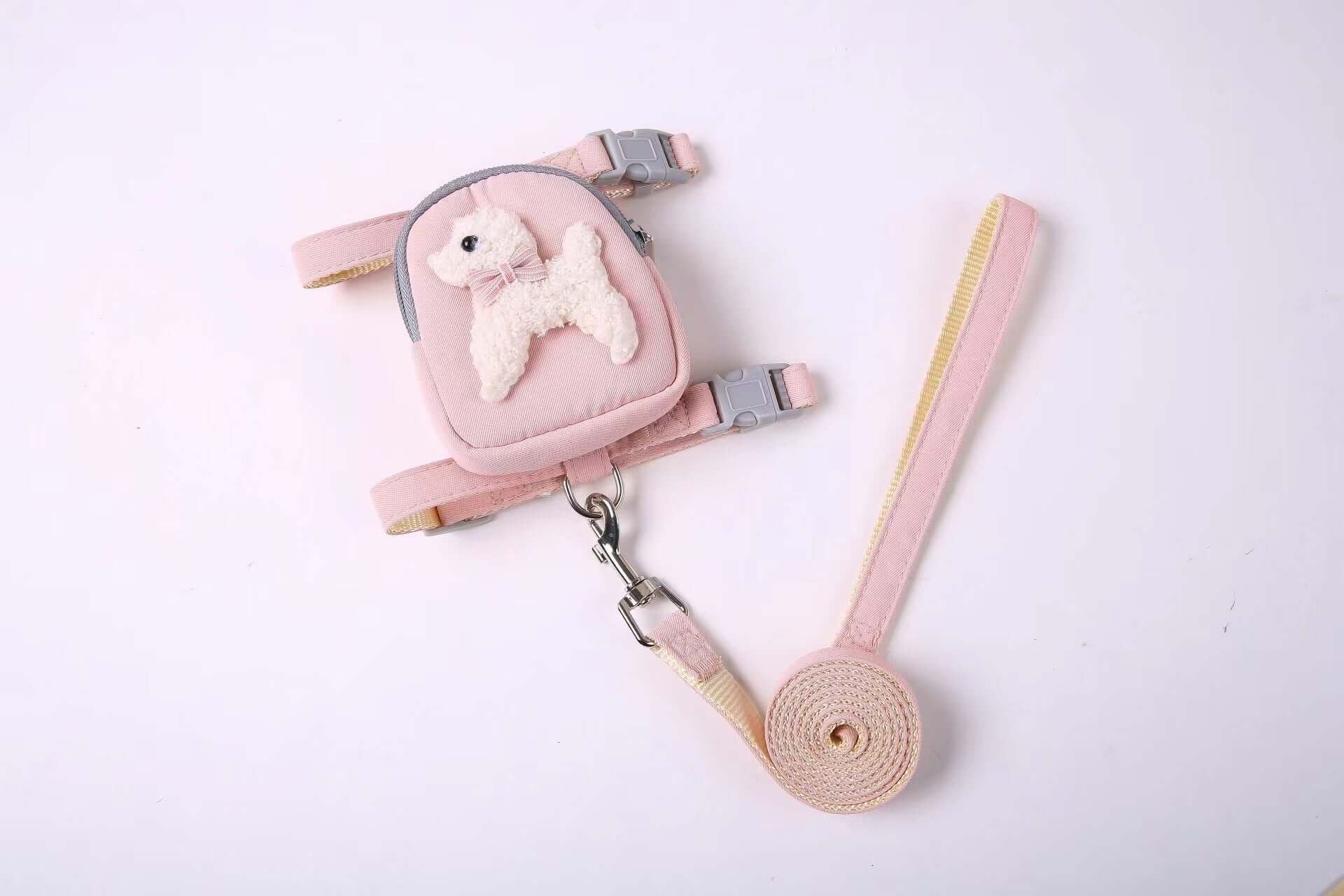 Sac à dos rose pour animaux avec harnais et laisse, idéal pour le confort et la sécurité des chiens et chats.