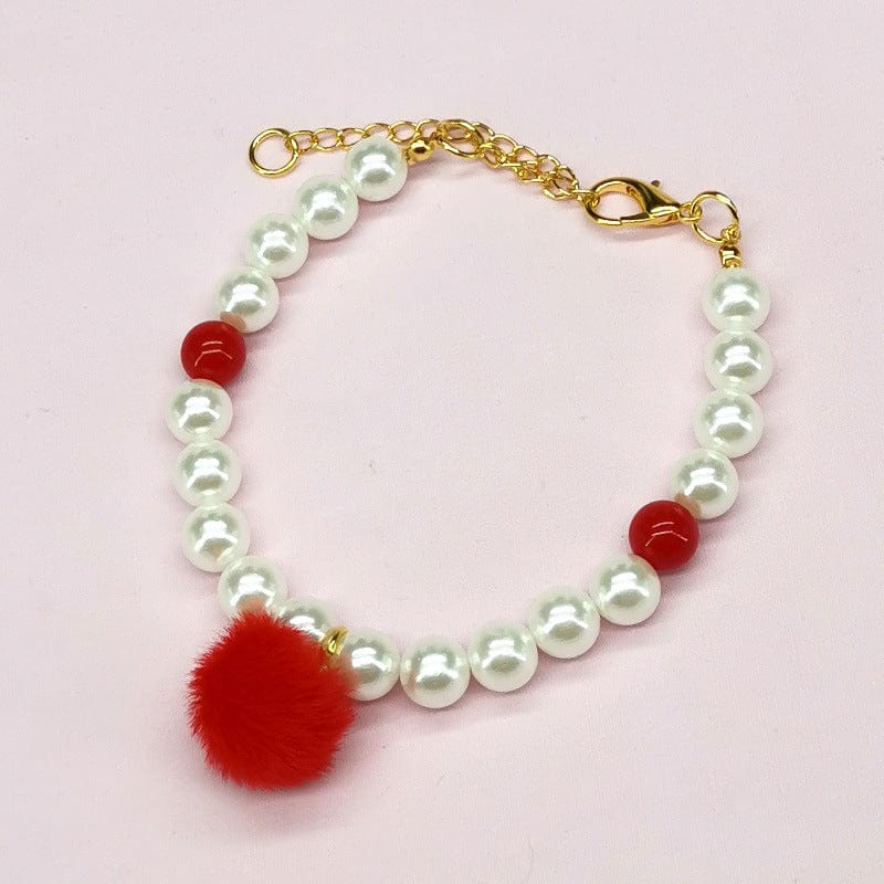 Collier pour animaux avec clochettes en perles et pompon rouge, parfait pour la Noël.
