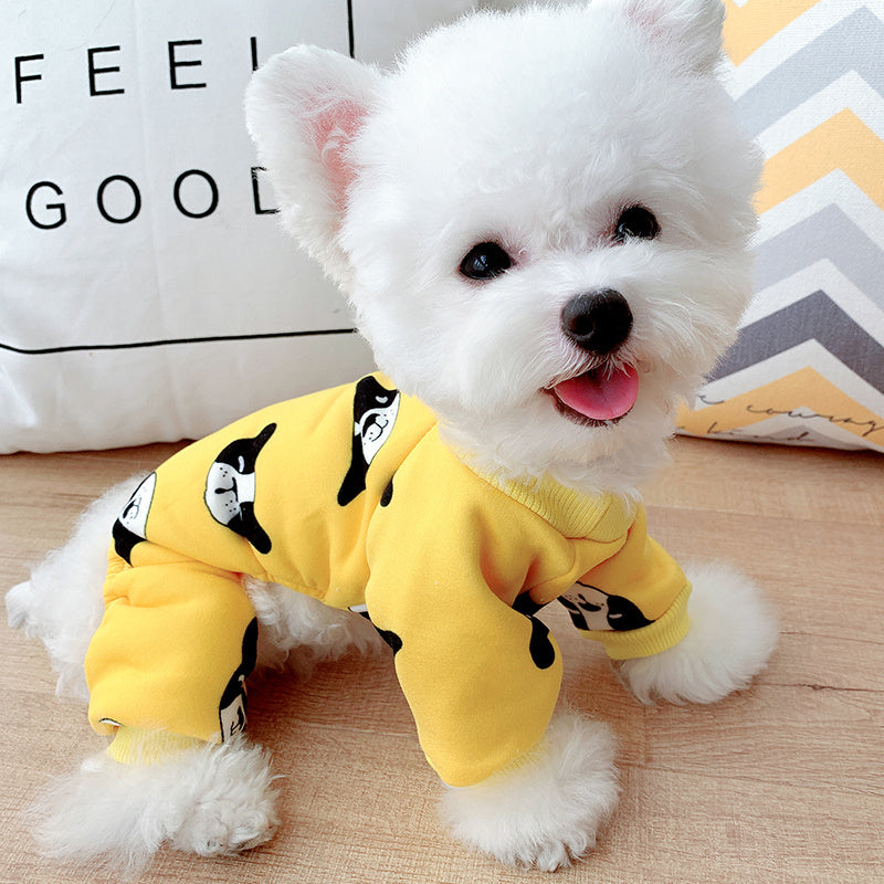 Charming dog in a yellow cotton outfit with panda print, perfect for keeping pets warm and stylish.