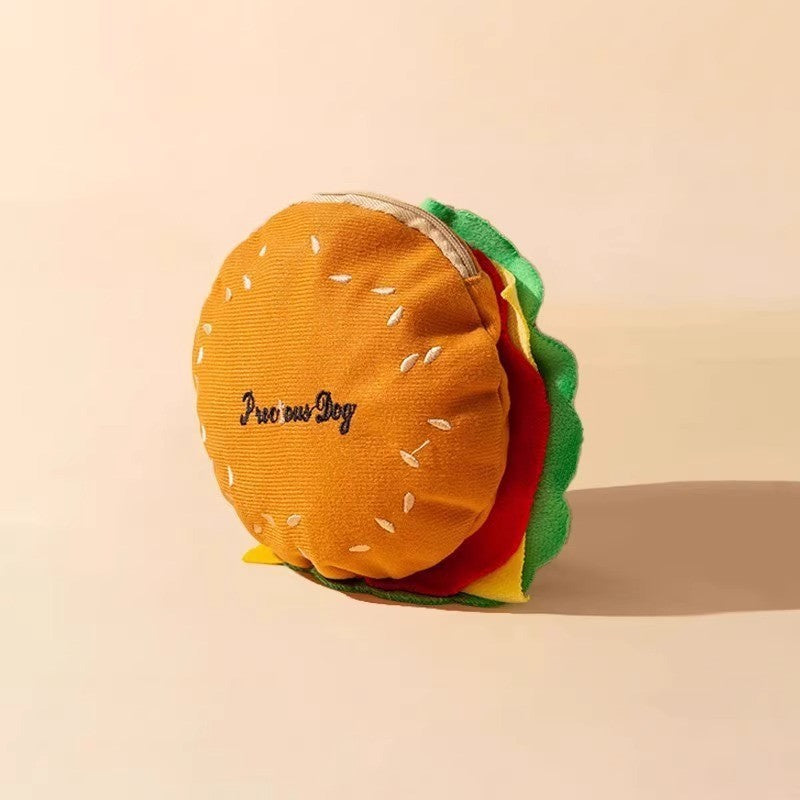 Jouet en forme de hamburger pour chien, coloré et amusant, idéal pour jouer et stimuler votre animal.