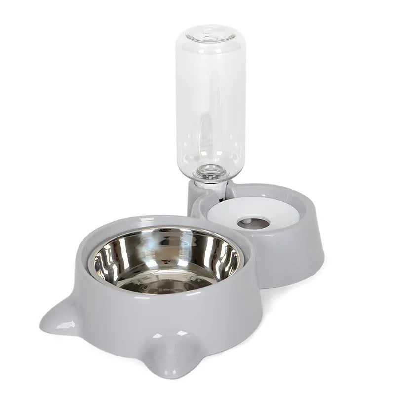 Distributeur automatique d'eau et de nourriture pour animaux avec bols en acier inoxydable et réservoir en plastique transparent.