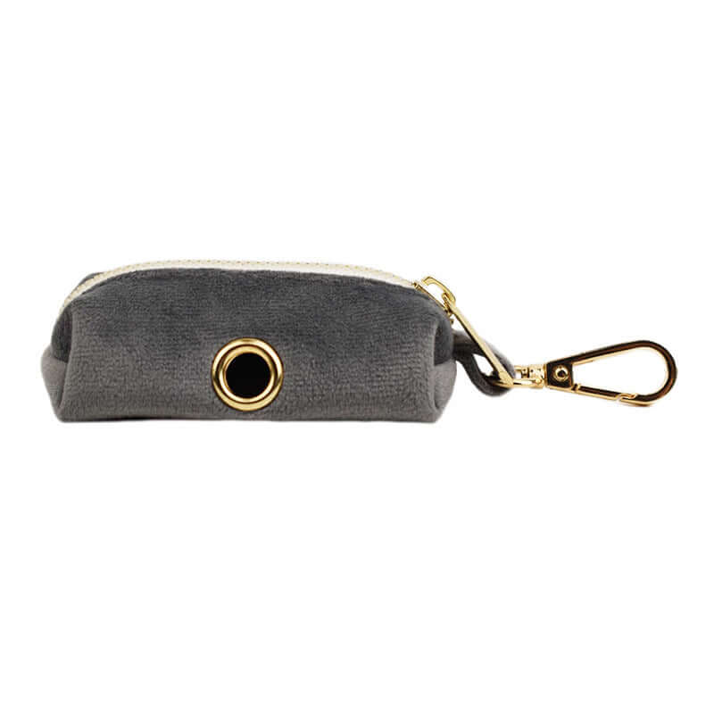 Grey velvet pet accessory pouch with gold clip, perfect for storing pet essentials.