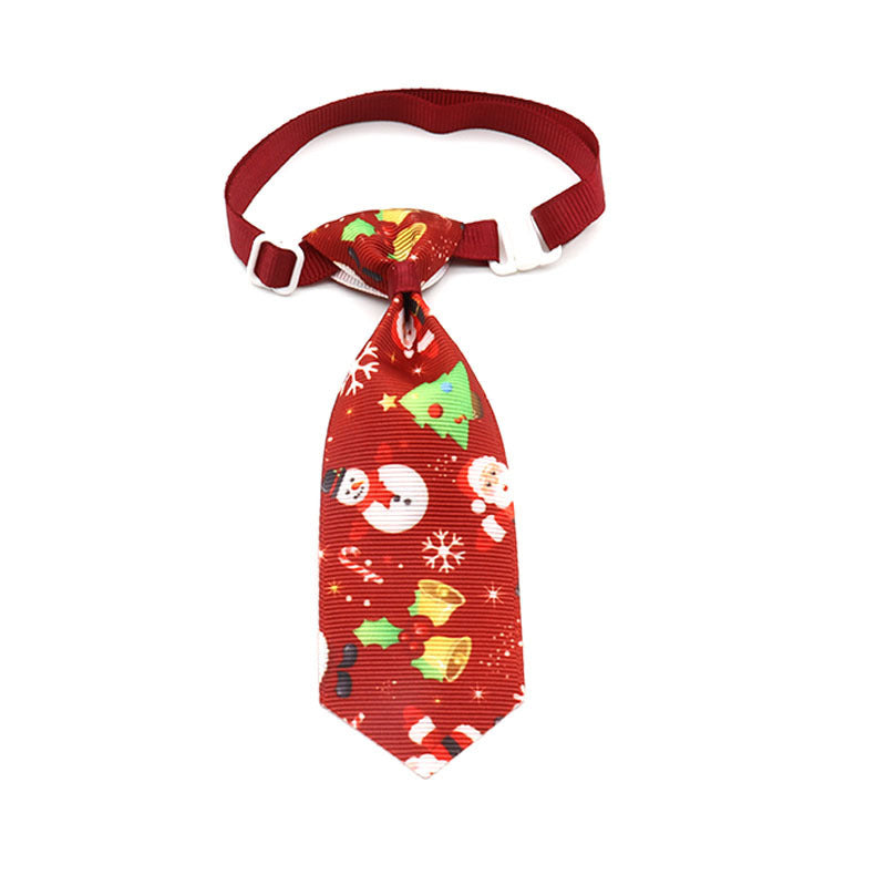 Nœud papillon de Noël pour animaux de compagnie avec motifs festifs et couleur rouge.