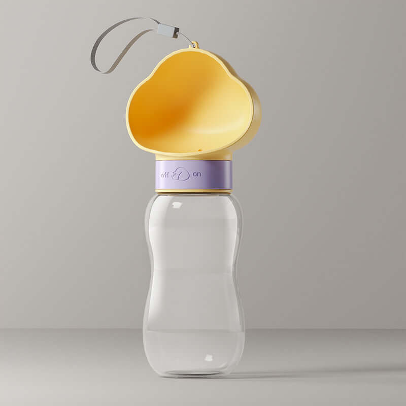 Gobelet d'eau portable pour chiens avec un design en jaune, idéal pour les promenades avec votre animal de compagnie.
