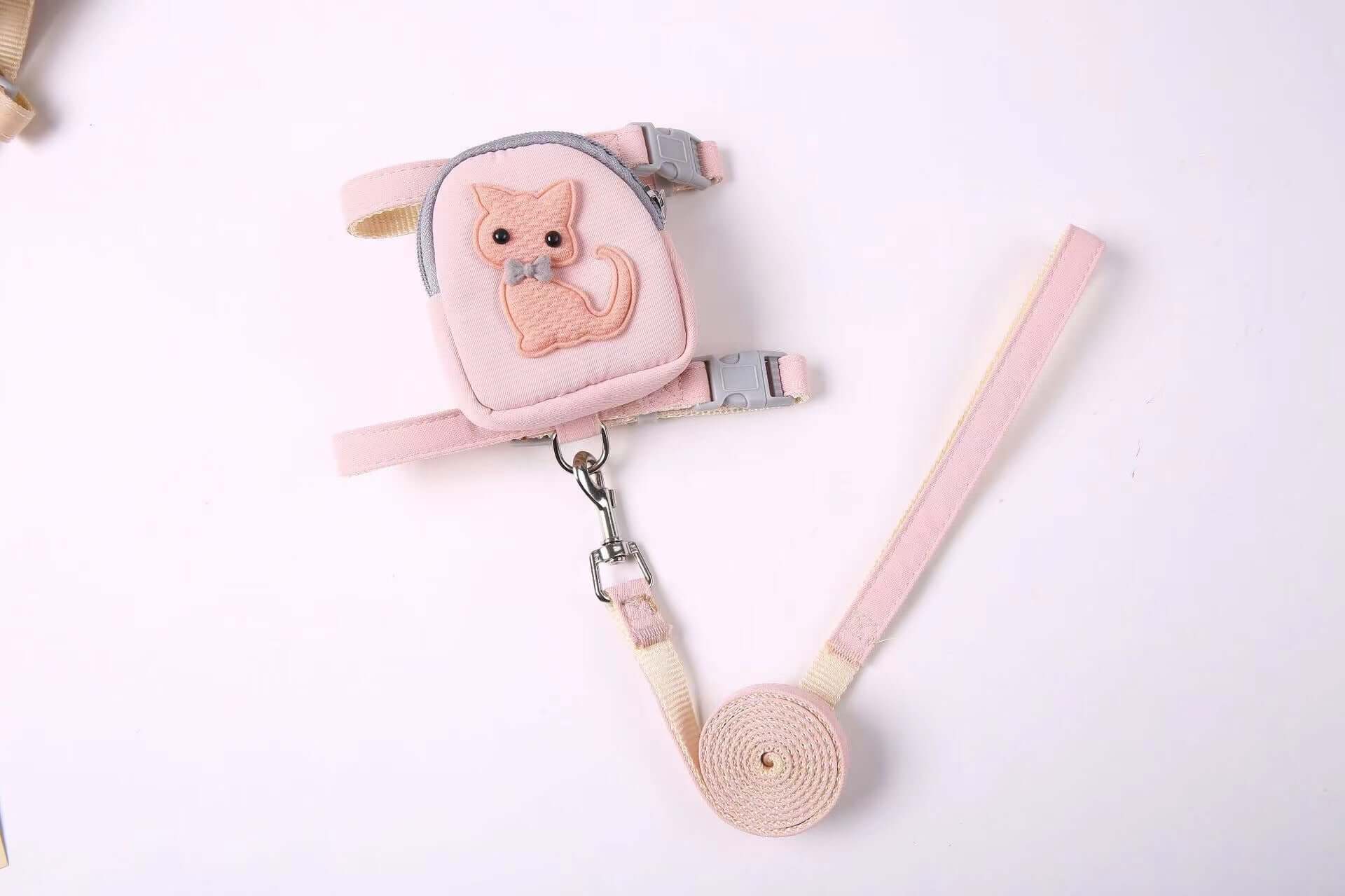 Sac à dos pour animaux avec harnais rose et laisse pour chat, idéal pour le confort et la sécurité.