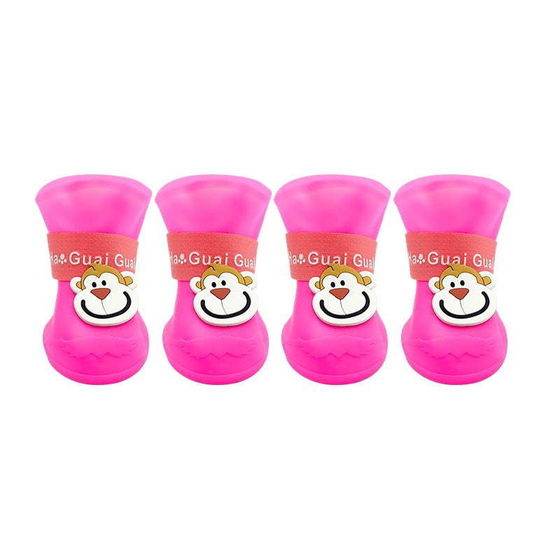 Bottes en silicone roses pour animaux avec motif de singe, adaptées pour protection et confort.