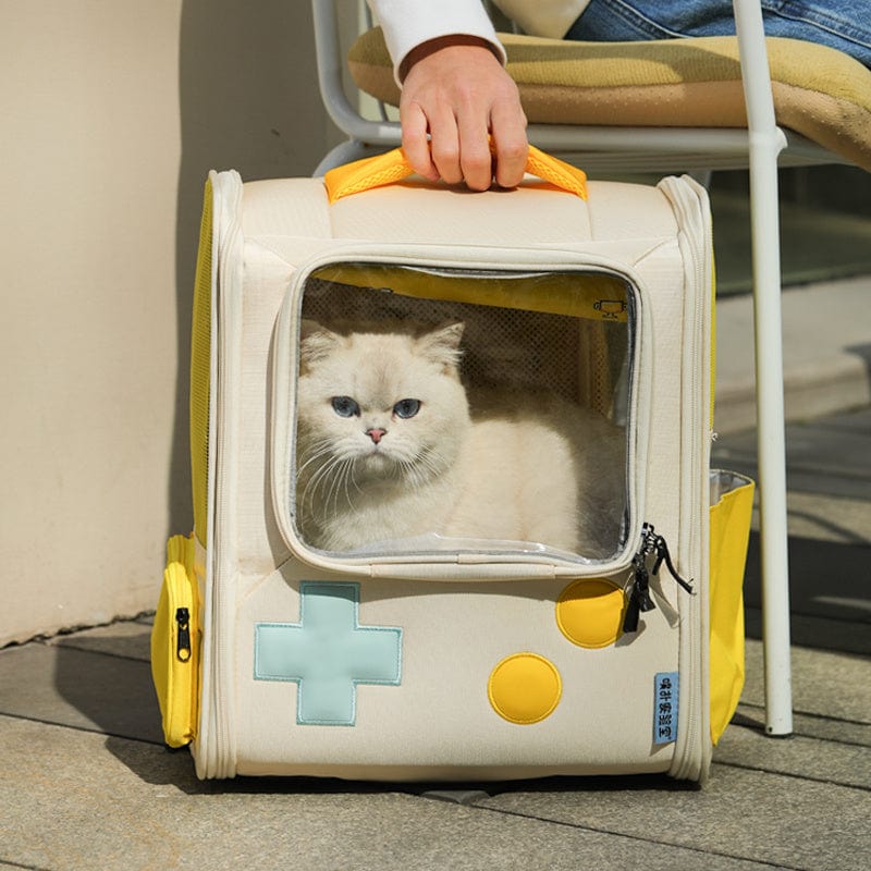 Sac à dos rétro pour animaux avec un chat à l'intérieur, coloris crème et jaune, idéal pour les voyages.