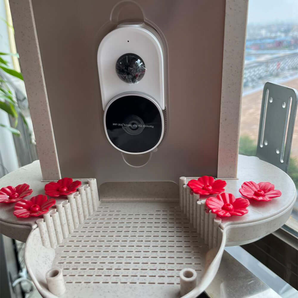 Distributeur Intelligent d’Oiseaux 160° avec fleurs décoratives, conçu pour nourrir les oiseaux avec précision.