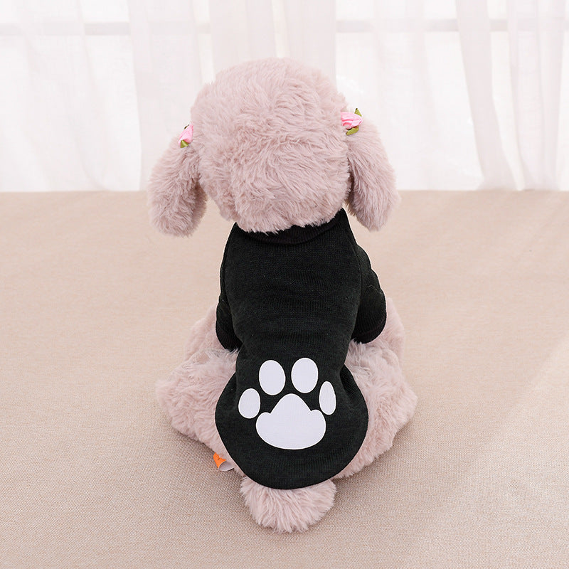 Pull pour chien noir avec motif de patte, parfait pour garder votre animal au chaud et stylé.